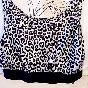 A cropped cheetah print tank top